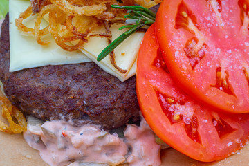 burger with cheese and tomatoes slices