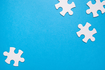 puzzle for teamwork. Playing jigsaw game. blue background and copy space