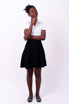 Full body shot of young beautiful African woman as student