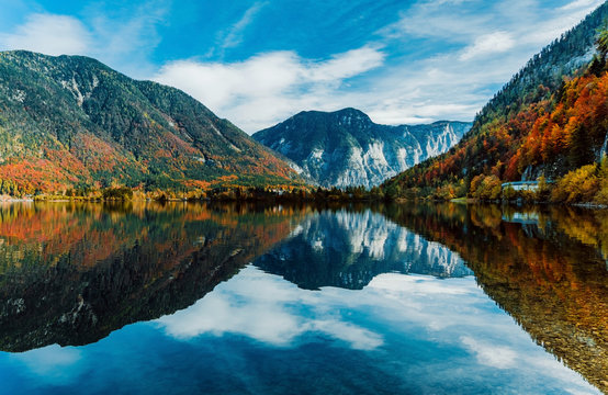 Panoramic view of the famous mountain village Hallstatt, Austria. Lake with reflections. © Artem