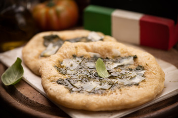 Italian stone baked  with  pesto sauce and parmesan cheese produced in Italy