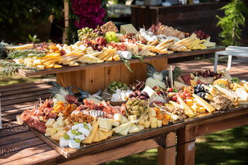 A table full of cheese and appetizers for a party or  wedding  