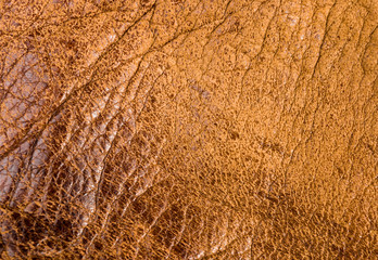 Fototapeta na wymiar Old vintage genuine soft brown leather texture background, top layer with pores and scratches, macro, close-up