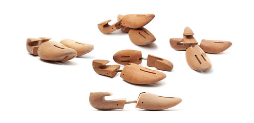 Group of wooden shoe pads and stretchers isolated on a white