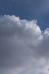 Fluffy clouds of the spring sky. Cold sky with clouds.