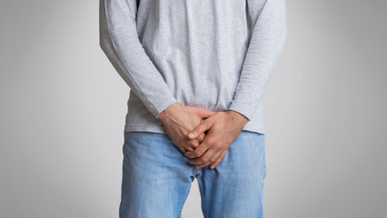 Man feeling pain in groin inflammation or bladder problem