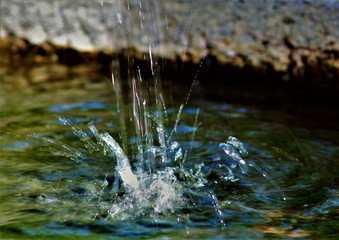 water drop into fountain