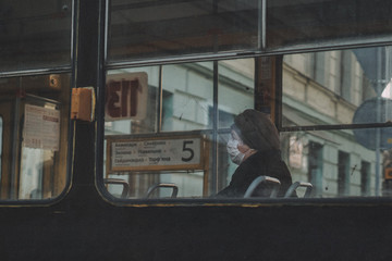 old lady in tram during covid-19 