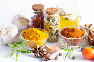 Organic aromatic spices, herbs and vegetables on white kitchen table close up. Healthy and tasty...