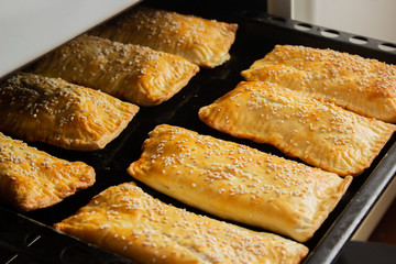 homemade meat patties on the baking sheet