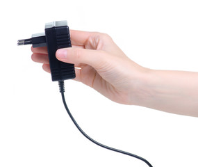 Power Supply ac to dc adapter in hand on white background isolation