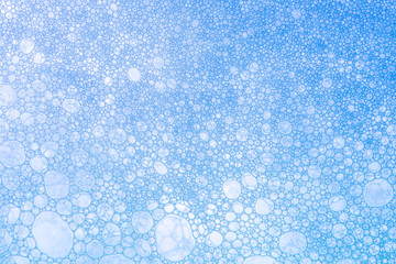 Macro Oxygen bubbles in water on a blue background, concept such as ecology and other your...