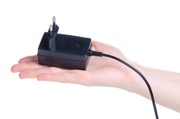 Power Supply ac to dc adapter in hand on white background isolation