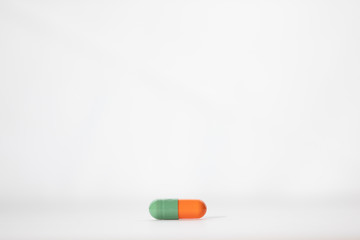 red and blue pill isolated on white background lower third negative space text ready