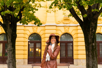 Attractive woman smiling at park during autumn, Zagreb, Croatia.