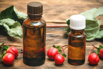Hypericum berry essential oil bottles concept.