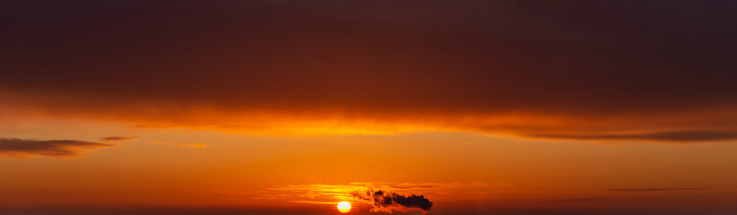 Fantastic dark thunderclouds at sunrise