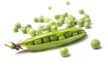 Closeup of fresh organic peas on white background