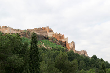 Fototapeta na wymiar Scenic view of medieval Sagunto castle on the green hill in Spain