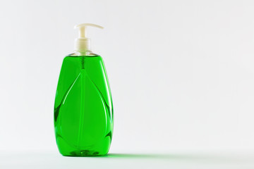Green liquid soap in plastic bottle for hand sanitation