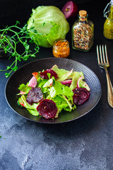healthy salad beetroot slices, iceberg lettuce, greens. Menu concept food background, keto or paleo diet. top view. copy space for text