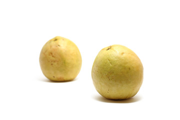 Two red guavas (Psidium guajava) isolated on white background, perfect for breakfasting during ramadan