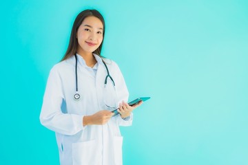 Portrait beautiful young asian doctor woman with stethoscope and smart tablet