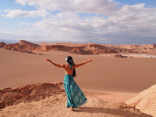 Girl model with long black hair in the long blue dress, Moon Valley, Atacama Desert, San Pedro de Atacama, Chile