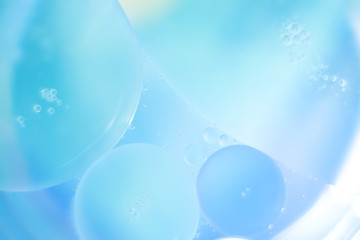 abstract background with bubbles oil drops on the water surface
