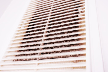 A layer of dust on the ventilation grill in the bathroom. To clean ventilation at home.