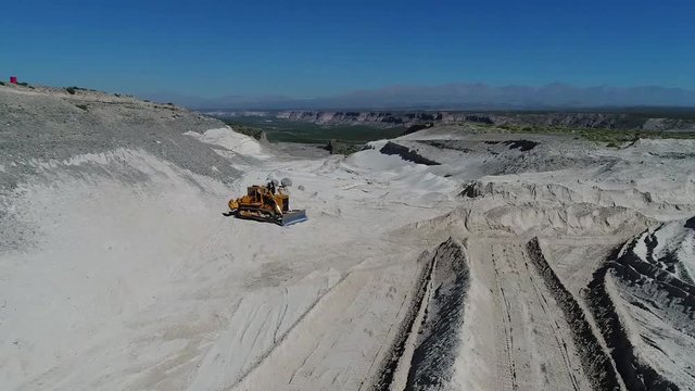 drone shot to bulldozer in soil movement