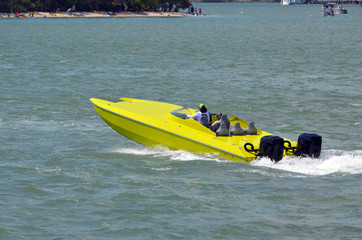 Bright yellow speed boat off Monument Island in Miami Beach,Florida