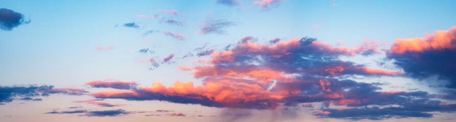 Naklejka na ściany i meble Skyline cloudscape dramatic beautiful rainy clouds at sunset