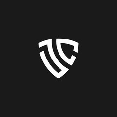JC monogram logo with shield shape