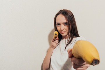 girl with banana pistols