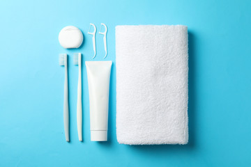 Flat lay with tools for dental care on blue background