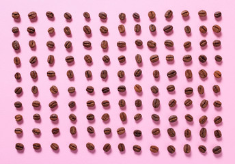 Coffee beans on a pink background. Food Background.