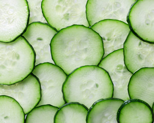 Green fresh cucumber slices. Food Background. Healthy eating. Top view. Vegetarian food.