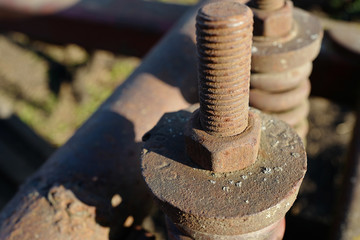 Rusty bolts and nuts on agricultural machinery
