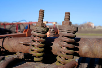 Rusty bolts and nuts on agricultural machinery