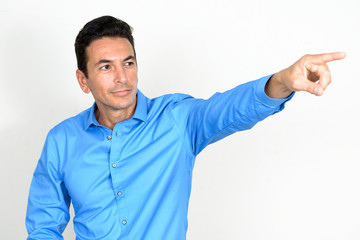 Portrait of mature handsome thinking and pointing finger
