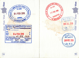 Immigration stamps of India and Taiwan in a French passport. Personal data removed