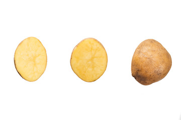 whole and cut potatoes on a white isolated background