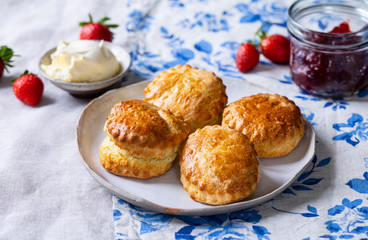 Freshly baked home made scones with strawbery jam and clotted cream