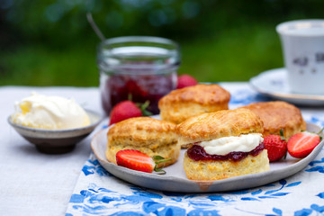 Freshly baked home made scones with strawbery jam and clotted cream