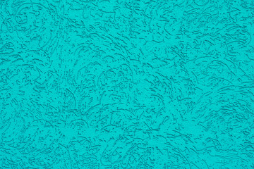Turquoise painted texture with abstract ornament, aqua color corrugated background, decorative ribbed mint green wall.