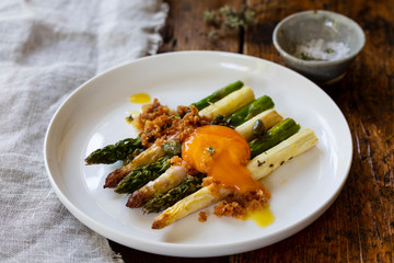 Roasted white and green aspatagus with capers and mustard dressing and cured egg yolk