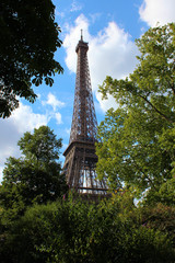 view on Eiffel tower under sunny summer sky