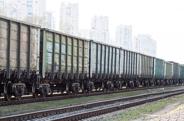 Fototapeta premium visual effect, residential buildings in freight train cars. freight railway transport