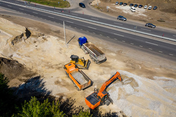 Aerial view of heavy machinery for crushing and collecting stone, limestone, sand and gravel,...